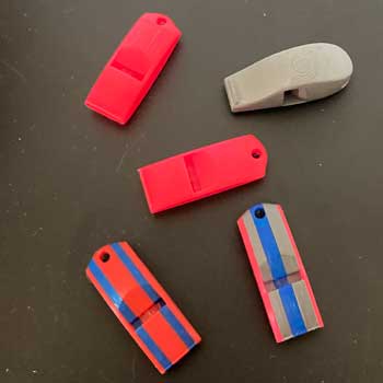 whistles in various colors