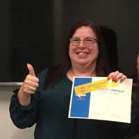 woman with first place certificate